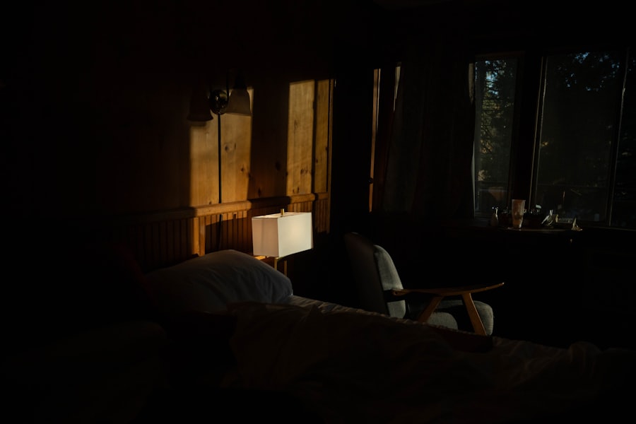 A warm lamp glowing in a dark, quiet, intimate room.